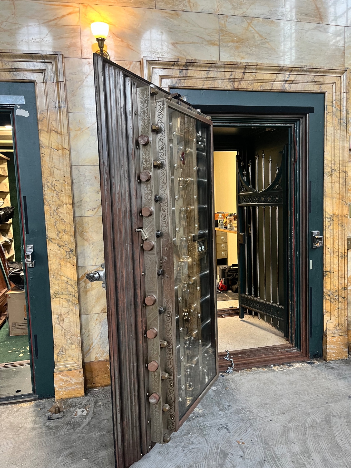 The original engraved steel bank vault door still standing inside Boulder Union's marble-lined hall